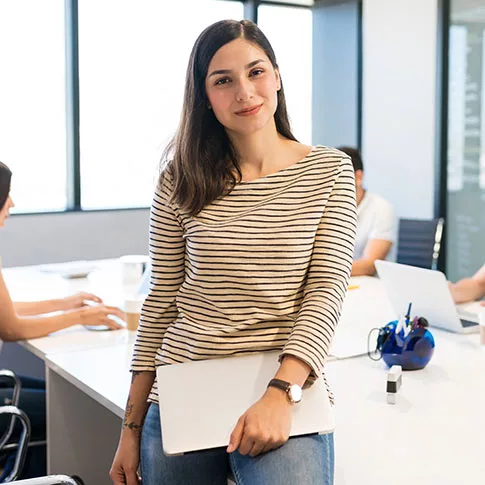 young female worker is standing and smiling